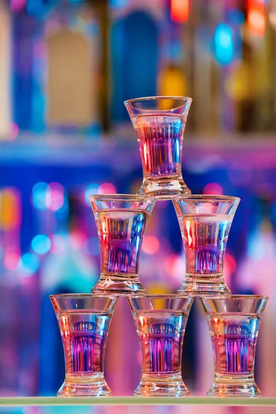 ATPXpj1f_depositphotos_144693739-stock-photo-pyramid-of-six-shot-glasses.jpg